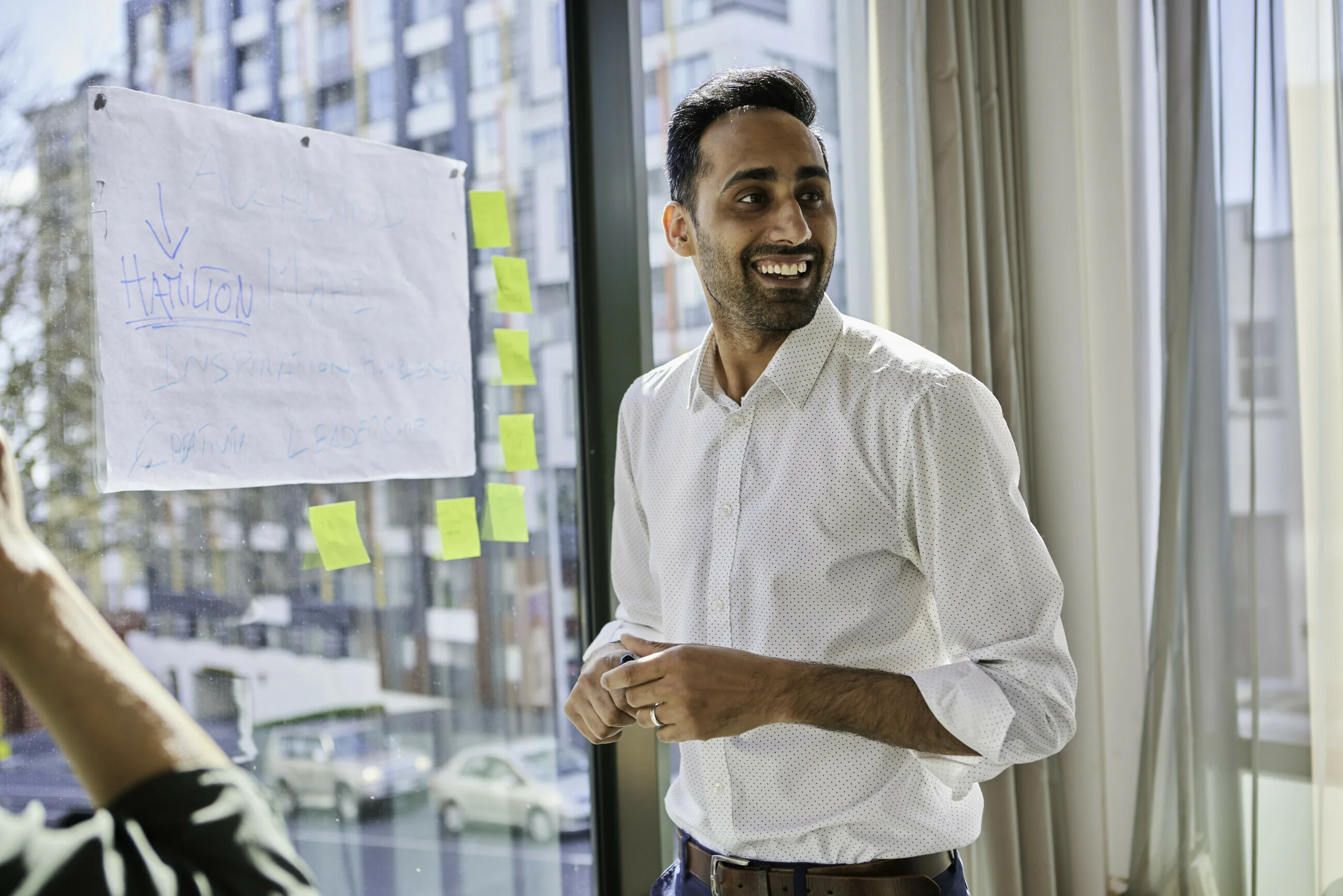 A business owner leading a workplace financial education session