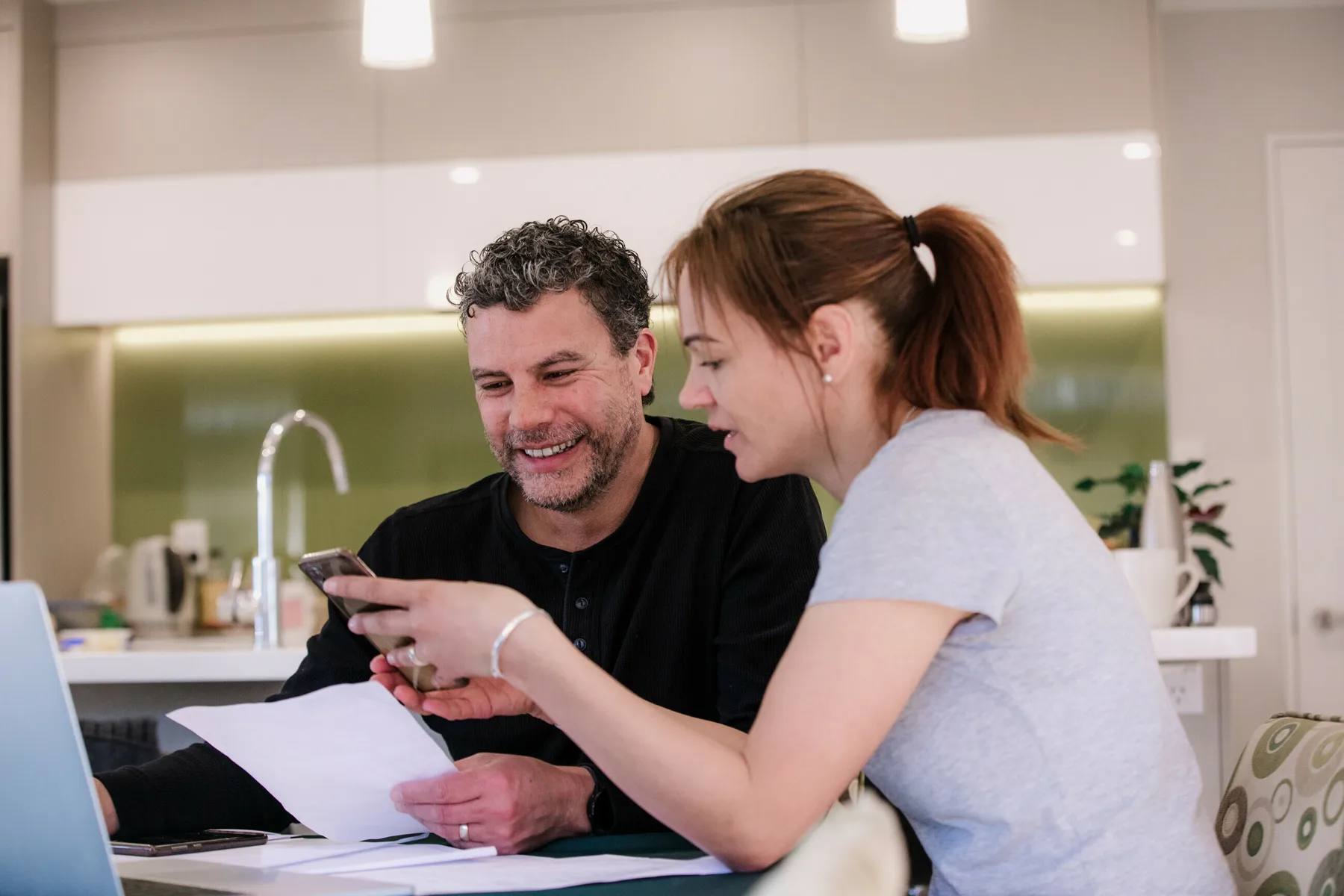 Clients reviewing financial information together