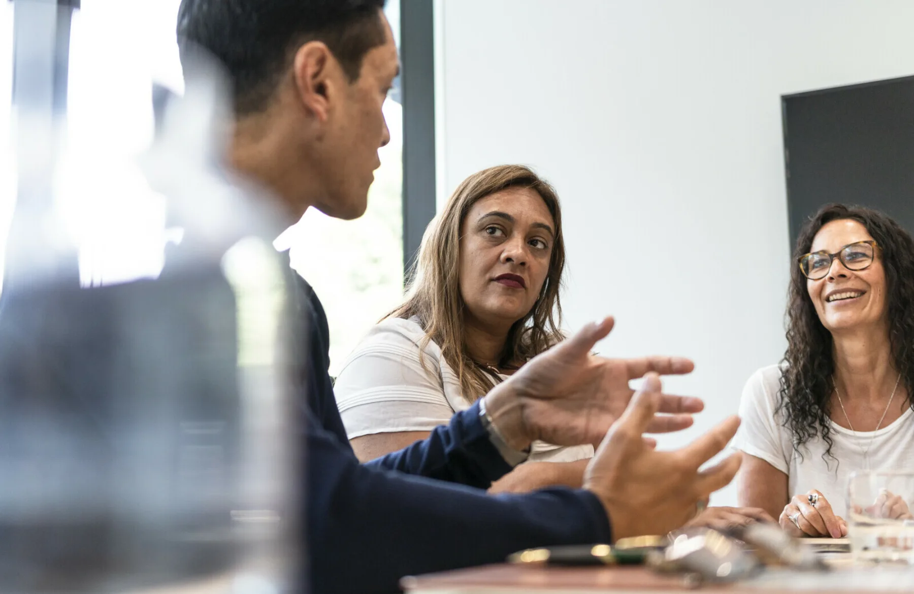 Colleagues sharing ideas in a purpose-led workplace