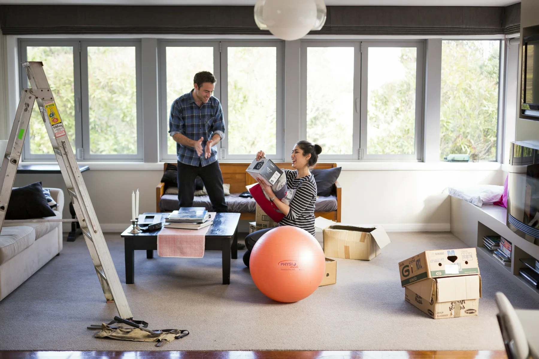 People carrying boxes while moving house